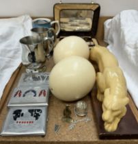 Two ostrich eggs together with a resin tiger, tankards, cigarette cases,