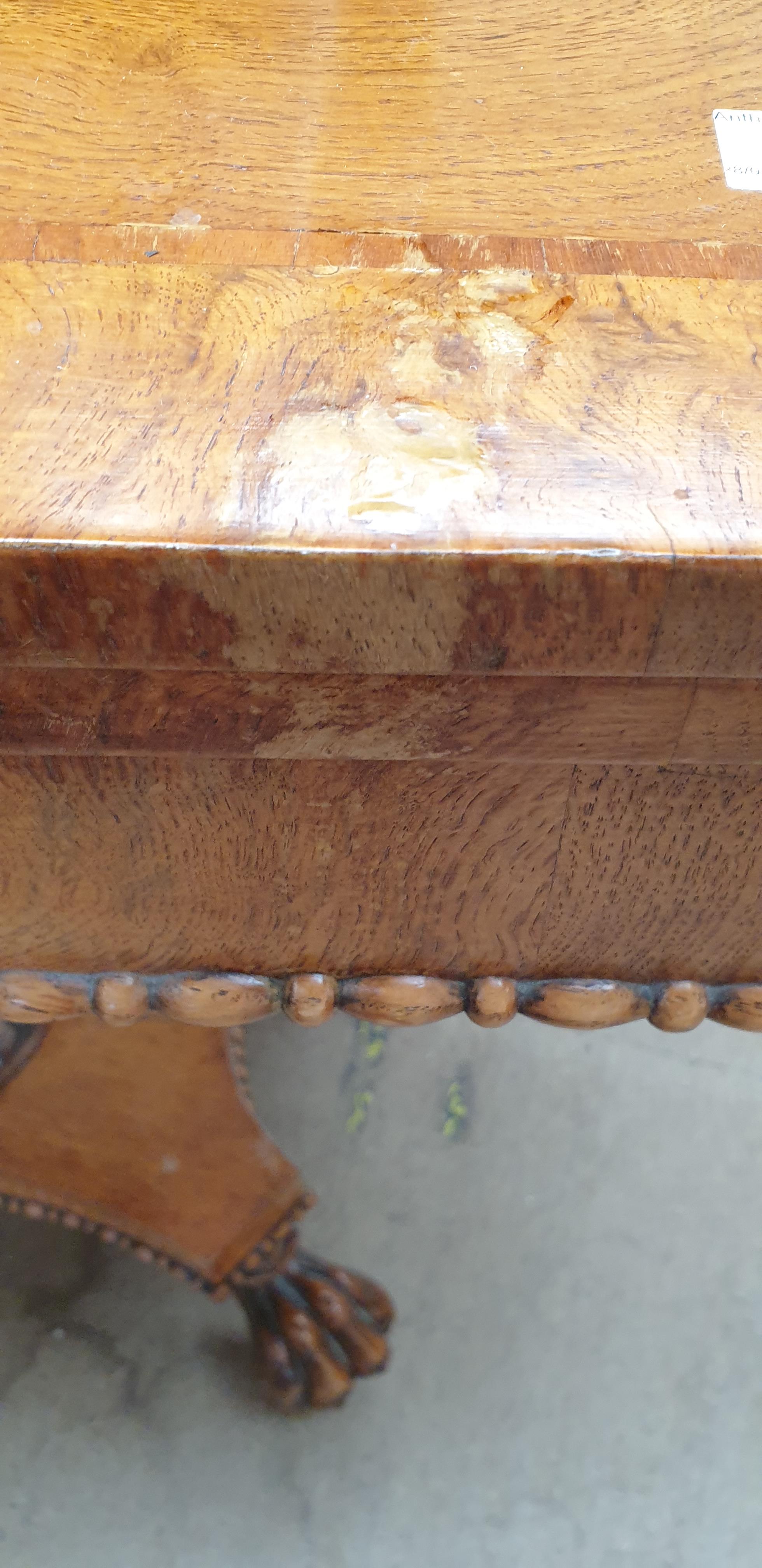 A Victorian oak card table with a crossbanded top above a moulded frieze and fold over baize top on - Image 8 of 10