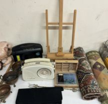 An easel together with a Steepletone BAD radio, Freeplay radio, brass bowls,
