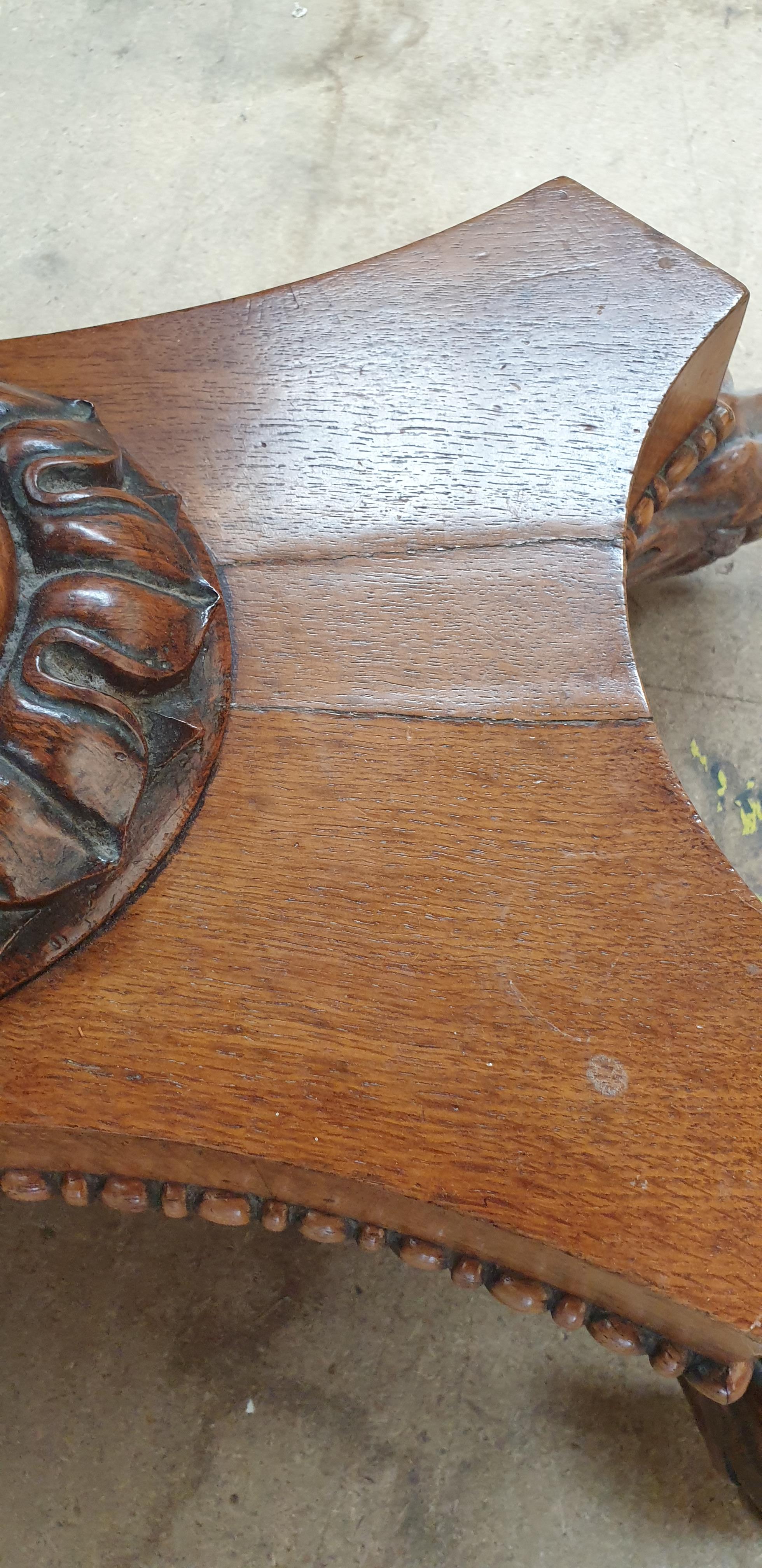 A Victorian oak card table with a crossbanded top above a moulded frieze and fold over baize top on - Image 9 of 10