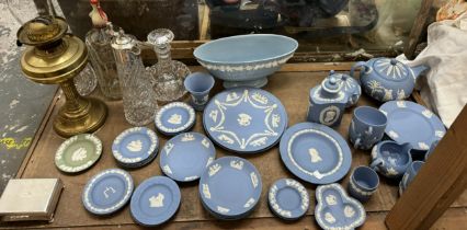 A collection of Wedgwood jasper ware plates together with glass decanters, brass oil lamp,