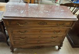A French walnut marble topped commode with four graduated drawers on carved legs,