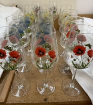 A collection of floral decorated wine glasses