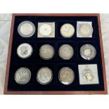 Twelve assorted coins, some silver including a George IIII Crown dated 1822, an 1886 one dollar,