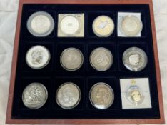 Twelve assorted coins, some silver including a George IIII Crown dated 1822, an 1886 one dollar,