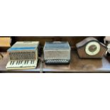 A Hohner Student piano accordion together with another Hohner accordion and an oak mantle clock