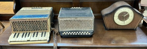 A Hohner Student piano accordion together with another Hohner accordion and an oak mantle clock