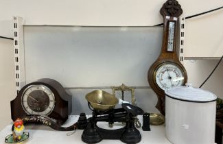 A carved oak barometer together with a mantle clock, scales, enamel pot and cover,