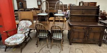 An Ercol dining table and six chairs,