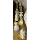 A collection of Royal Worcester candle snuffers including Mob Cap, Mrs Caudle, Owl, Feathered Hat,