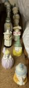 A collection of Royal Worcester candle snuffers including Mob Cap, Mrs Caudle, Owl, Feathered Hat,