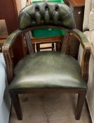 A green leather upholstered office chair