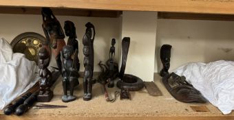 An African tribal mask together with other African carvings etc
