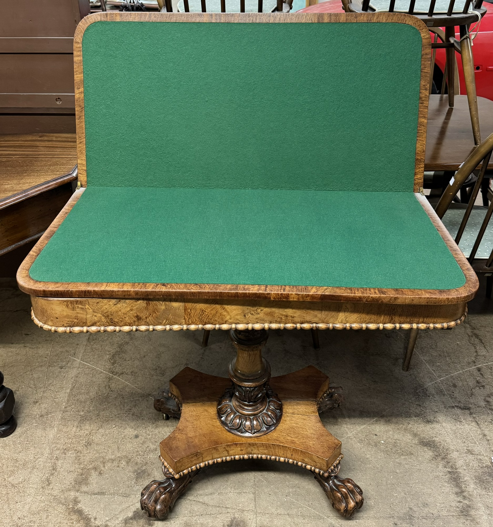 A Victorian oak card table with a crossbanded top above a moulded frieze and fold over baize top on - Image 2 of 10