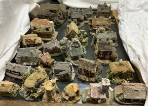 A collection of circa twenty four Lilliput Lane cottages