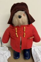 A 1974 Paddington Bear in red felt coat and blue Dunlop Wellington boots