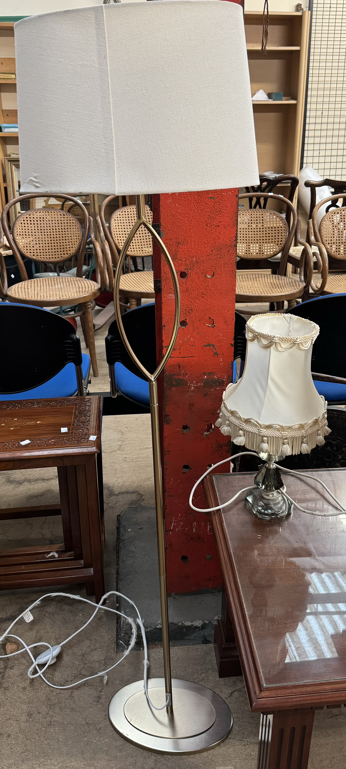 A brass standard lamp together with a table lamp