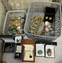 A collection of costume jewellery including brooches,