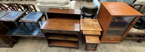 A mahogany nest of three tables together with two bookcases,