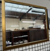 A large rectangular gilt wall mirror