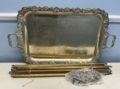 A large electroplated twin handled tray together with brass stair rods and clips