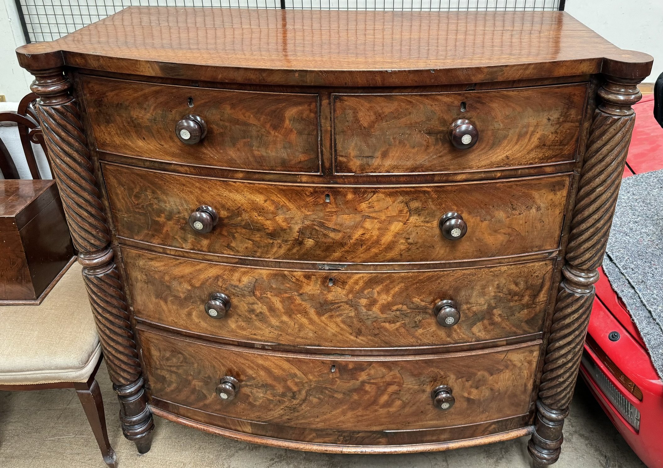 A Victorian mahogany chest with a D shaped top and rope twist columns with two short and three long