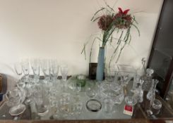 A crystal glass bowl together with decanters and assorted drinking glasses