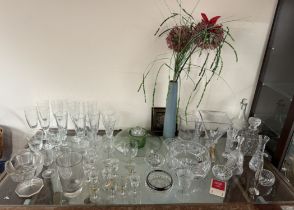 A crystal glass bowl together with decanters and assorted drinking glasses