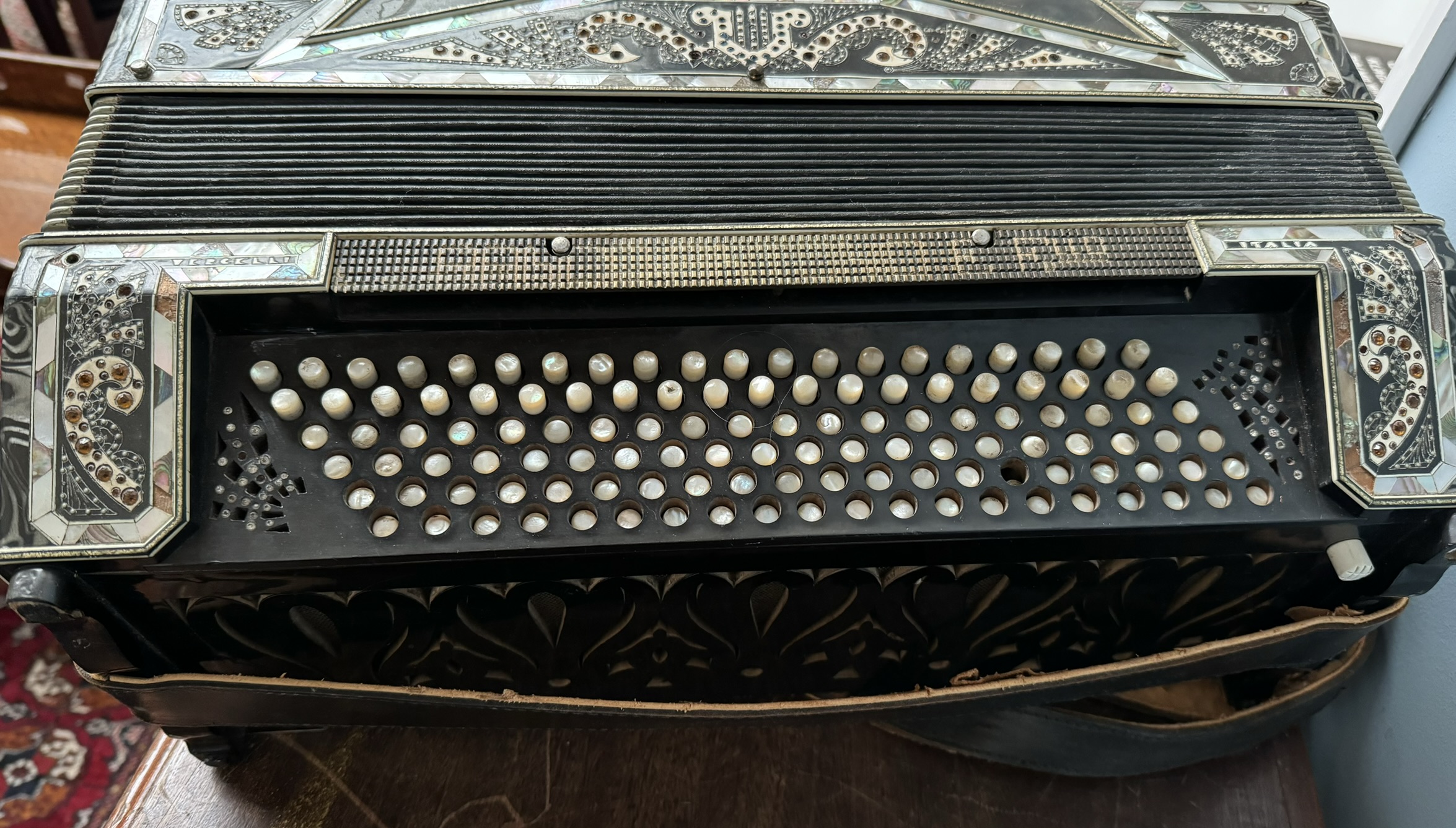 A piano accordion with 64 mother of pearl keys and buttons, - Image 2 of 2