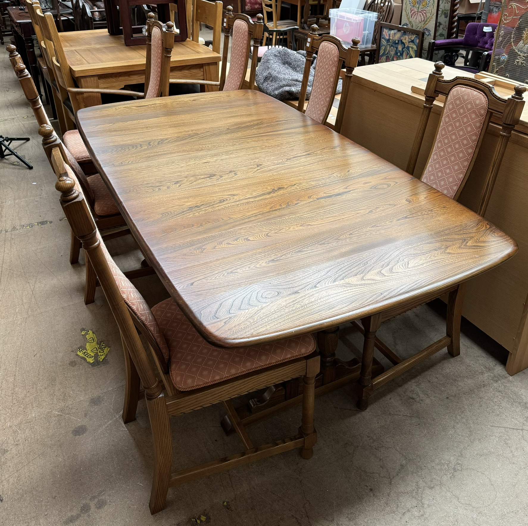 An Ercol dining suite comprising an extending dining table, - Image 3 of 3