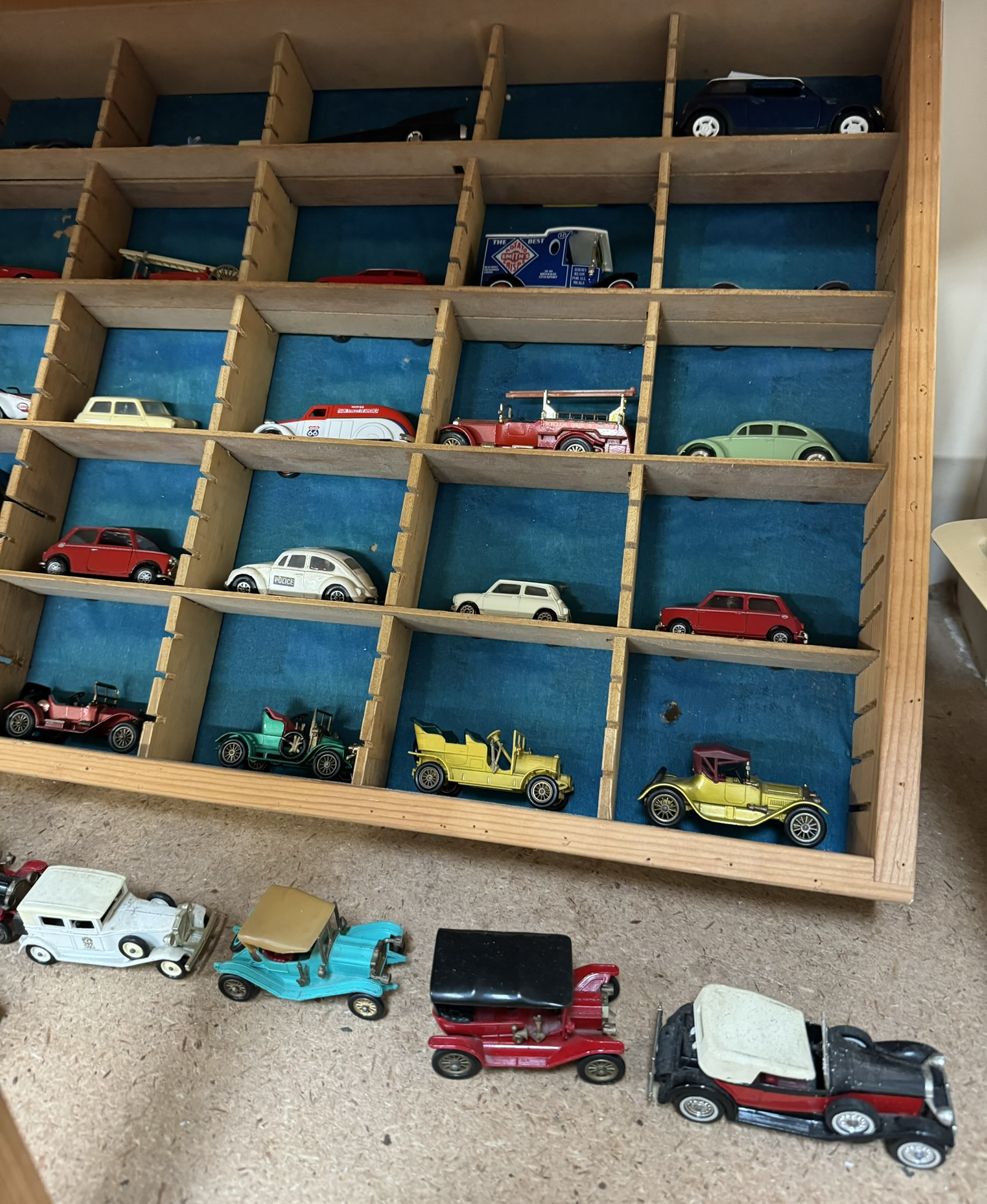 A collection of corgi and other model cars in a sectional shelf unit together with a boxed Corgi - Image 2 of 4