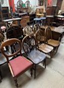A matched set of six wheelback dining chairs together with two other chairs,