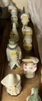 A collection of Royal Worcester candle snuffers including Mob Cap, Mrs Caudle, Owl, Feathered Hat,