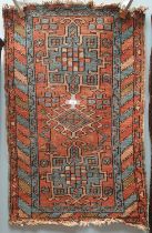 A rug with a blue ground decorated with two medallions and stars to multiple guard stripes,