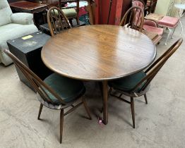 An Ercol drop leaf dining table and four hoop back chairs