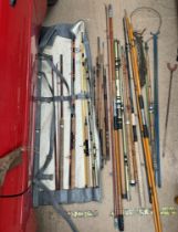 A Double Gold Seabass 10' carbon fishing rod together with an Olympic fibreglass 12ft rod,