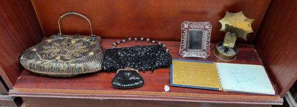 A brass shell case converted into an ashtray with match book holder,