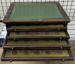 A coin collectors four drawer coin cabinet