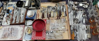 Assorted stainless steel cutlery together with drinking glasses etc