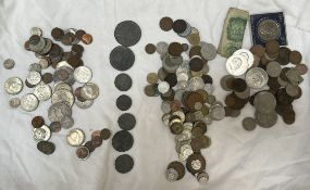 Assorted coins including 1964 Liberty half dollars, 1922, Silver Dollar, Churchill crowns,