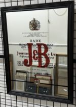 A Justerini & Brooks Ltd advertising mirror for J & B rare blended Scotch Whisky