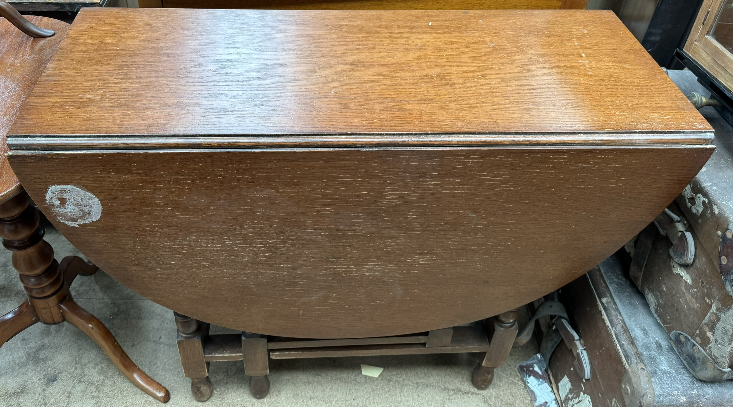 A 20th century oak gateleg dining table