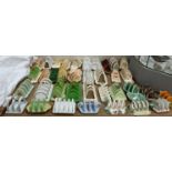 A collection of pottery toast racks including Crown Devon, Sylvac, Burleigh Ware,