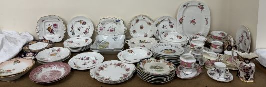 A collection of 19th century floral painted plates and dishes together with ribbon plates,