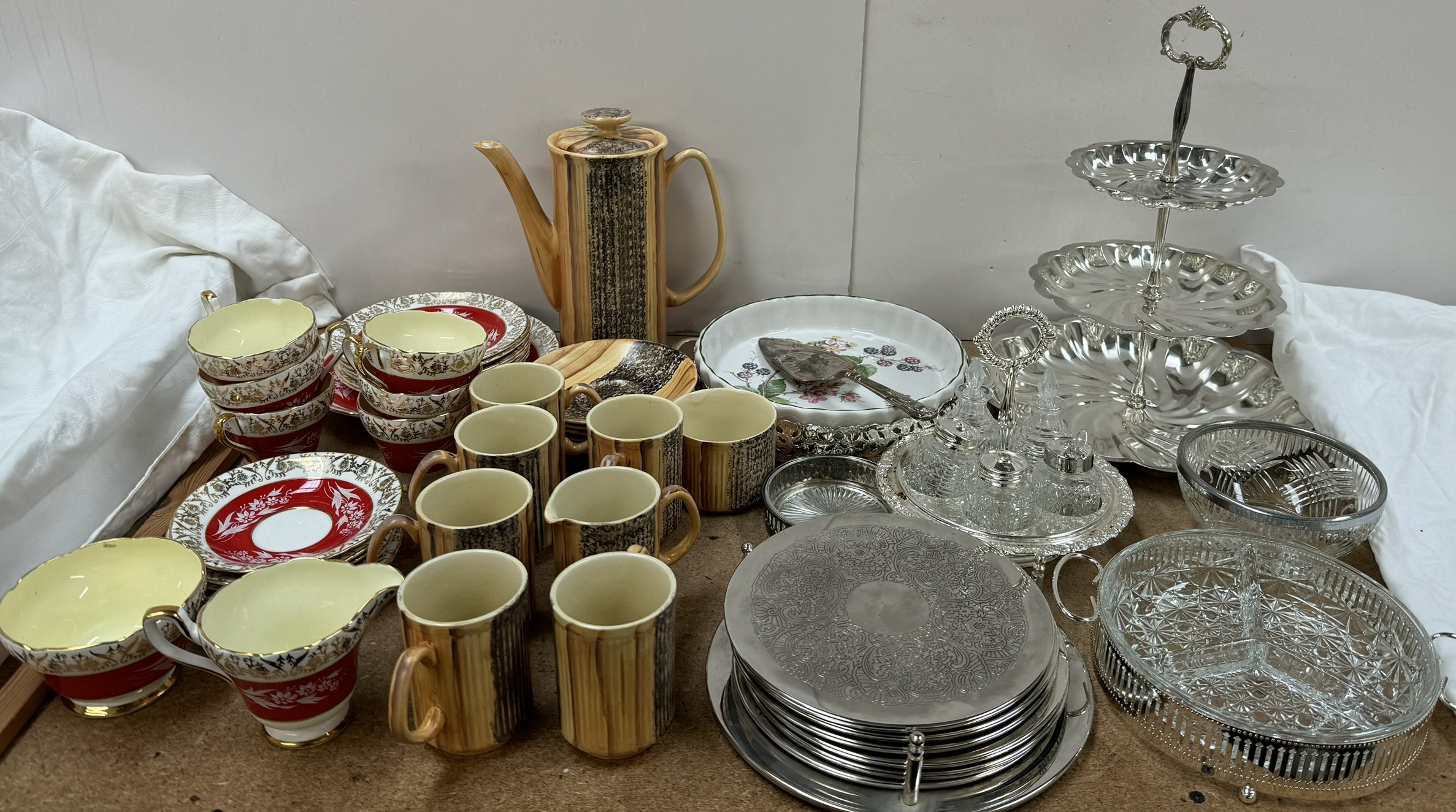 A Price wood effect part tea set together with a Sutherland Bone china part tea set & electroplated