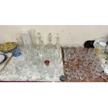 A crystal camel together with glass decanters, drinking glasses,