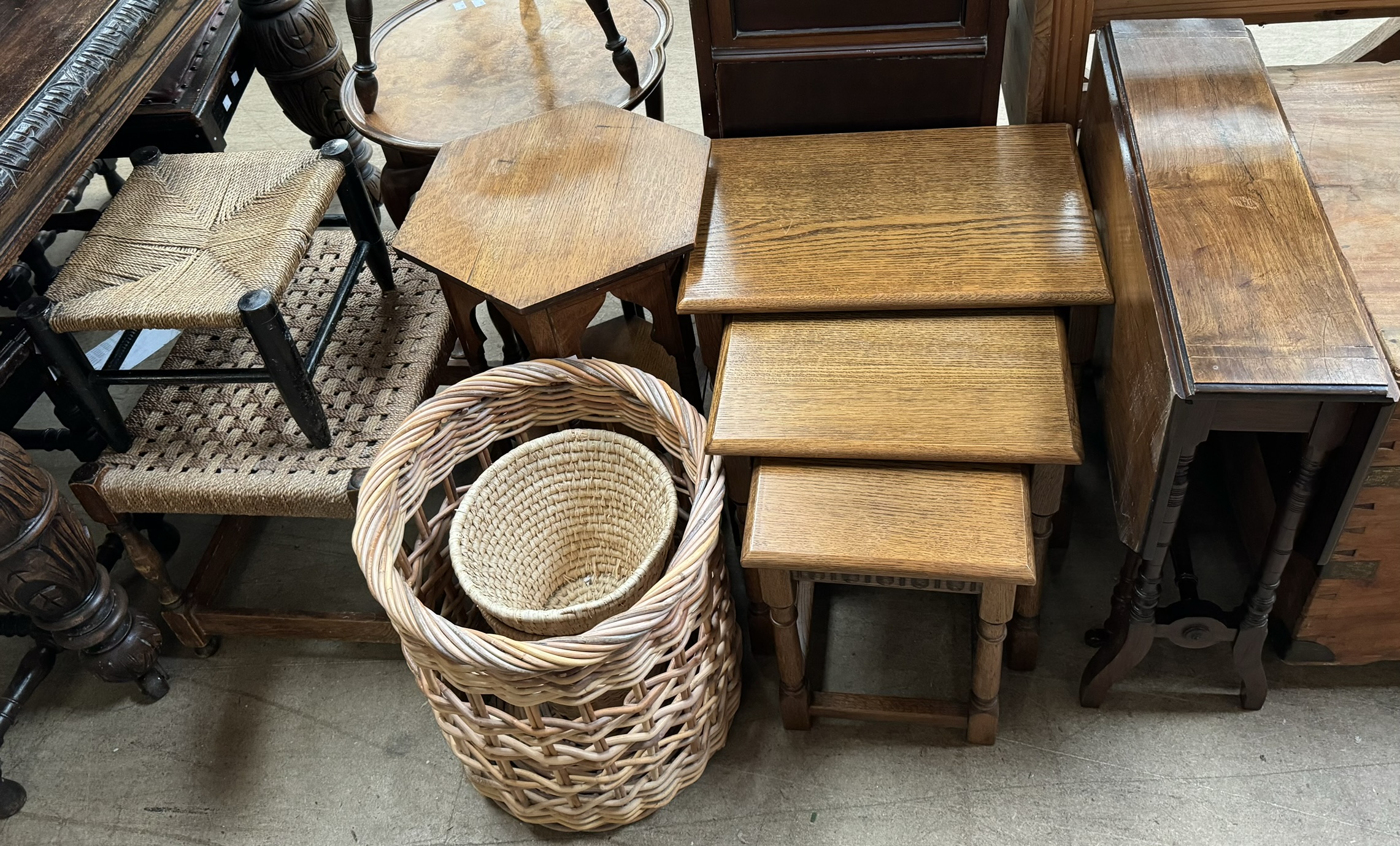 A Sutherland table together with a nest of three oak tables, an occasional table,