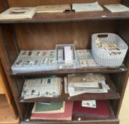 An extensive collection of cigarette cards, loose and in albums, together with coins, paper money,