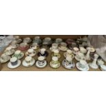 A large collection of Royal Worcester cabinet cups and saucers, including Enchantment pattern,