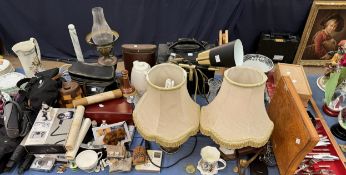 Assorted cameras and binoculars together with tripods, oil lamp, table lamps,